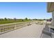 Large outdoor deck with seating and open views at 5302 S Robb Ct, Littleton, CO 80127