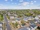 Scenic aerial view showcases a residential neighborhood with lush greenery and mountain views in the distance at 2010 Irving St, Denver, CO 80211