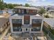 Birds eye view of house construction with modern stone and wood elements that highlight its location within a city setting at 2010 Irving St, Denver, CO 80211