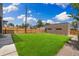 Expansive backyard with lush green grass and modern fence at 2010 Irving St, Denver, CO 80211