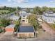 Aerial view of backyard showing garage, swing set, and the new construction's flat roof design at 2010 Irving St, Denver, CO 80211