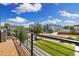 Beautiful balcony with wood tiles and views of the neighborhood and clear blue skies at 2010 Irving St, Denver, CO 80211