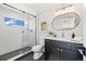 Modern bathroom with walk-in shower, sleek vanity, and stylish fixtures at 2010 Irving St, Denver, CO 80211