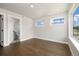 Bedroom featuring natural light and hardwood flooring, with easy access to an ensuite bathroom at 2010 Irving St, Denver, CO 80211