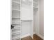 Bright closet with built-in shelves and wooden floor at 2010 Irving St, Denver, CO 80211