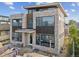 Front elevation showcasing modern design, featuring stone and wood finishes and large windows, enhanced curb appeal at 2010 Irving St, Denver, CO 80211