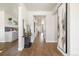 Well-lit hallway with hardwood floors and modern decor, creating an inviting transition between living spaces at 2010 Irving St, Denver, CO 80211