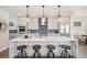 Spacious kitchen with a large island, pendant lighting, modern appliances, and stylish finishes for gourmet cooking at 2010 Irving St, Denver, CO 80211