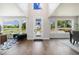 Bright living room with hardwood floors, large windows, and a modern entrance for a welcoming, light-filled atmosphere at 2010 Irving St, Denver, CO 80211