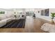Spacious living room boasts wood floors, modern decor, and ample natural light at 2010 Irving St, Denver, CO 80211