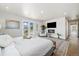 Bedroom with fireplace, television, and access to a balcony at 2010 Irving St, Denver, CO 80211
