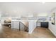 Bright staircase area with hardwood floors and a modern railing at 2010 Irving St, Denver, CO 80211