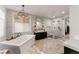 Bathroom featuring a soaking tub, walk-in shower, and modern fixtures at 5886 Amber Ridge Dr, Castle Pines, CO 80108
