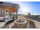 Inviting backyard fire pit area with scenic views, ideal for outdoor gatherings at 5886 Amber Ridge Dr, Castle Pines, CO 80108