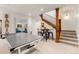 Spacious game room with ping pong table, stairs, and plenty of room for recreation at 5886 Amber Ridge Dr, Castle Pines, CO 80108