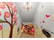 Charming hallway decorated with colorful murals and cute plush toys at 5886 Amber Ridge Dr, Castle Pines, CO 80108