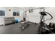 Well-equipped home gym with weights and modern exercise machines at 5886 Amber Ridge Dr, Castle Pines, CO 80108