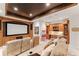 Cozy home theater with built-in cabinetry and comfortable seating at 5886 Amber Ridge Dr, Castle Pines, CO 80108