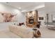 Inviting living room with stone fireplace, charming decor, and games at 5886 Amber Ridge Dr, Castle Pines, CO 80108