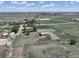 Spacious farm property featuring a home, outbuildings, a round pen, and extensive acreage at 2091 Tate Ave, Fort Lupton, CO 80621