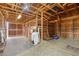 Barn interior showing wood beams, individual stalls and concrete floors at 2091 Tate Ave, Fort Lupton, CO 80621