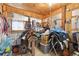 Barn storage area with saddles, tack, and other horse-related equipment at 2091 Tate Ave, Fort Lupton, CO 80621