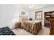 Bedroom featuring floral accents, soft lighting, and carpeted floors at 2091 Tate Ave, Fort Lupton, CO 80621