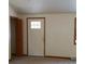 Bright entryway featuring a white front door with glass panels and a closet for convenient storage at 2091 Tate Ave, Fort Lupton, CO 80621