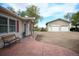 Exterior view of the ranch home, featuring a stamped concrete walkway and large detached two-car garage at 2091 Tate Ave, Fort Lupton, CO 80621
