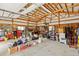 Spacious garage with wooden framing, ample storage, and potential workshop space at 2091 Tate Ave, Fort Lupton, CO 80621