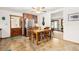 Eat-in kitchen featuring stainless steel appliances, wood cabinets, and a dining area at 2091 Tate Ave, Fort Lupton, CO 80621