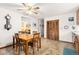 Kitchen and dining area featuring tile flooring, natural wood trim, and ample space at 2091 Tate Ave, Fort Lupton, CO 80621