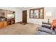 Inviting living room featuring a large window for natural light, and cozy furnishings at 2091 Tate Ave, Fort Lupton, CO 80621