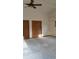 Spacious living room with laminate flooring, closet storage, and air conditioning at 2091 Tate Ave, Fort Lupton, CO 80621