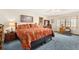 Comfortable main bedroom featuring floral accents, soft lighting, and carpeted floors at 2091 Tate Ave, Fort Lupton, CO 80621