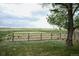 A large fenced pasture with grasses ready for livestock at 2091 Tate Ave, Fort Lupton, CO 80621
