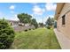 Spacious backyard with a well-kept lawn and privacy fence, perfect for outdoor gatherings at 8588 E Costilla Ave, Centennial, CO 80112