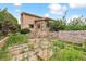 Landscaped backyard with stone accents, offering a serene outdoor retreat at 8588 E Costilla Ave, Centennial, CO 80112