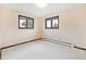Cozy bedroom with two windows and neutral tones, creating a serene atmosphere at 8588 E Costilla Ave, Centennial, CO 80112