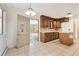 Classic kitchen featuring wooden cabinets, tiled countertops, and tile flooring at 8588 E Costilla Ave, Centennial, CO 80112