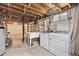 Unfinished laundry room featuring a utility sink, washer, and dryer hookups at 8588 E Costilla Ave, Centennial, CO 80112