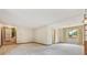 Bright and spacious living room featuring carpeted floors and neutral paint colors at 8588 E Costilla Ave, Centennial, CO 80112