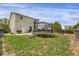 Backyard with a trampoline, patio, grill, and access to the home at 1341 Kingfisher Ave, Brighton, CO 80601