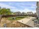 Spacious backyard featuring a trampoline, patio, and picnic table perfect for entertaining at 1341 Kingfisher Ave, Brighton, CO 80601