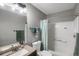 This bathroom has a tub with shower, vanity, and is well lit at 1341 Kingfisher Ave, Brighton, CO 80601