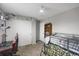 A bright bedroom features a loft bed, closet, and desk with gamer chair at 1341 Kingfisher Ave, Brighton, CO 80601