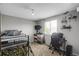 This room boasts a bunk bed, a window, a ceiling fan, and is great for playtime at 1341 Kingfisher Ave, Brighton, CO 80601