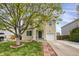 Lovely two-story home featuring a verdant lawn and brick-lined walkway at 1341 Kingfisher Ave, Brighton, CO 80601