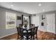 Bright eat-in kitchen featuring hardwood floors and large windows overlooking the backyard at 1341 Kingfisher Ave, Brighton, CO 80601