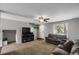 Inviting living room with ceiling fan, neutral walls, and cozy carpet at 1341 Kingfisher Ave, Brighton, CO 80601